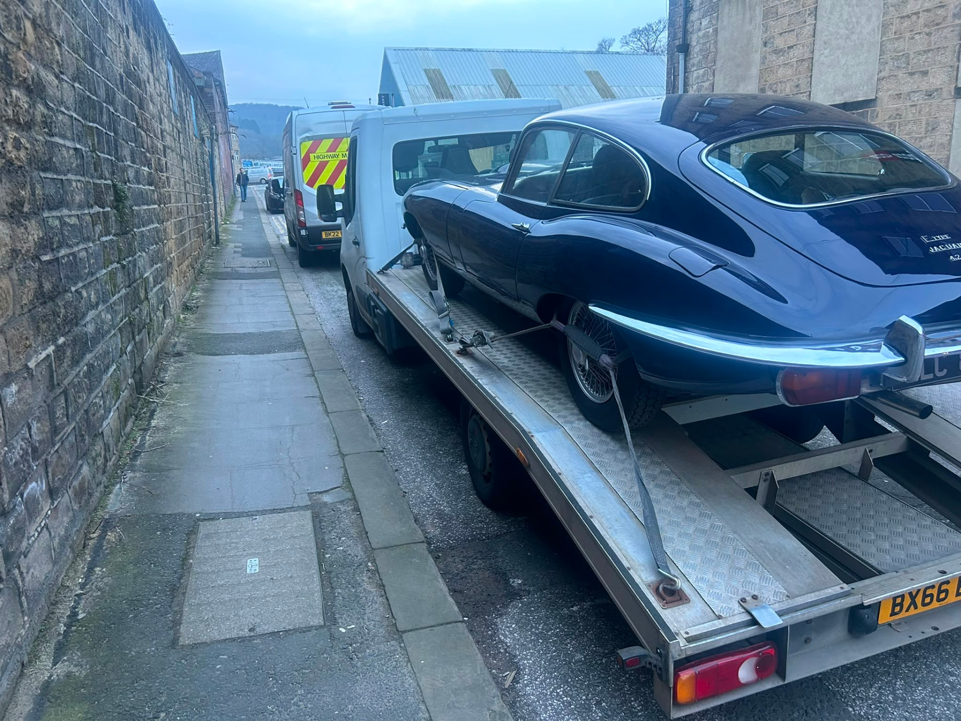 Classic Jaguar E-Type recovered on a flatbed transporter